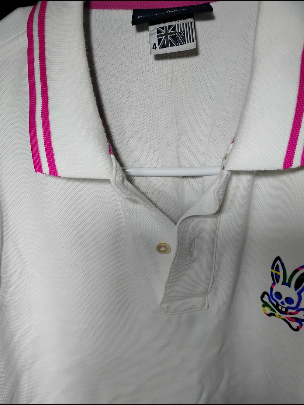 Psycho Bunny White Polo with Pink Trim and Navy Label
